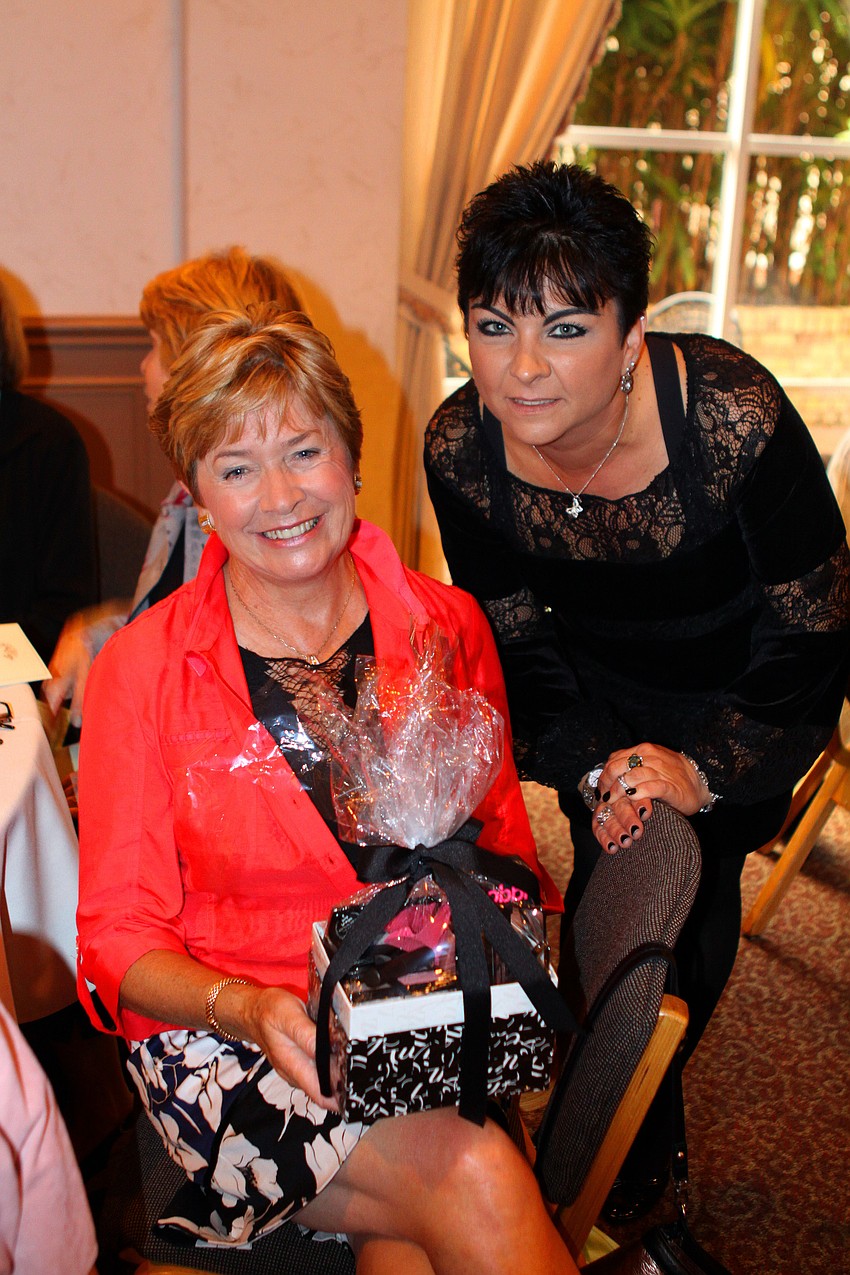 Mollie Anzelone poses with Breda Lambe who won the Bobbi Brown prize package at the St. Michaelâ€™s the Archangel Womenâ€™s Guild Annual Fashion Show and Luncheon.