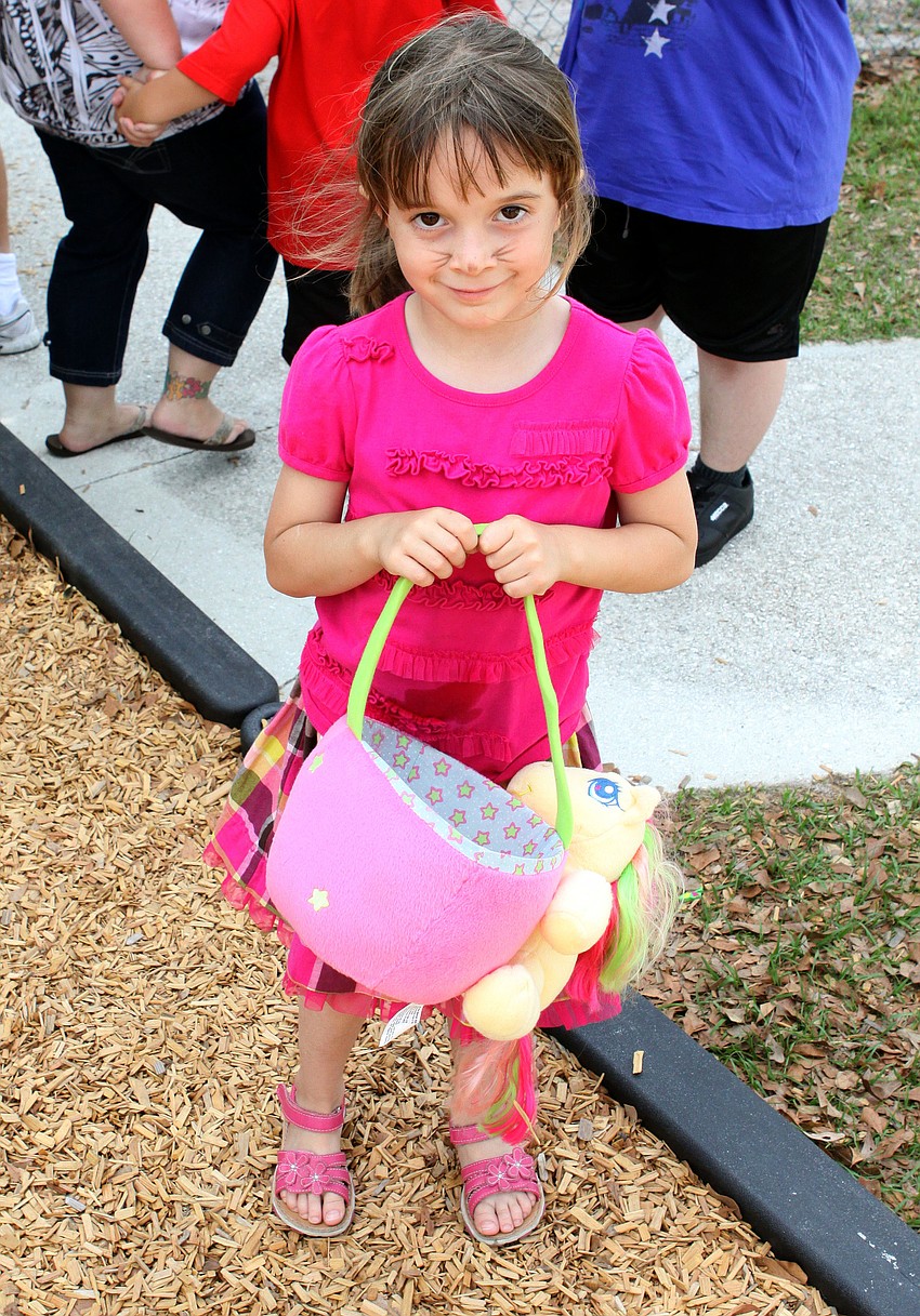 Hailey Renner, 5, brought a very fun Easter egg basket to collect her eggs in, Saturday, March 31, at the Face Autism Egg Hunt at Ashton Elementary.