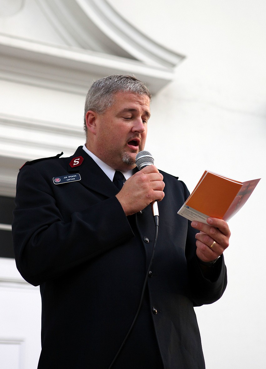 Jim Spencer reads at the 6th Station.