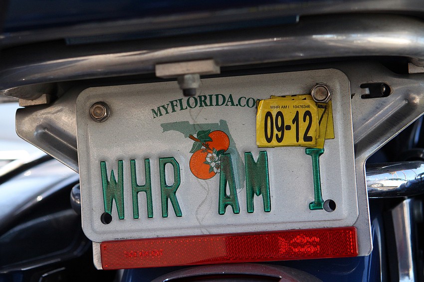 A comical license plate on one of the motorcycles read, 