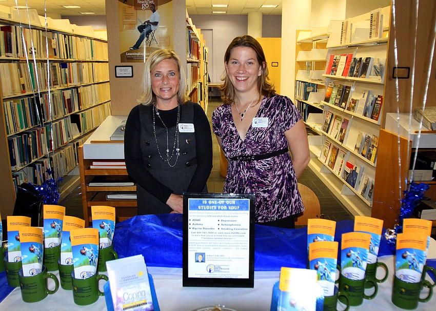Ginger Moritz and Jamie Smith worked the Florida Clinical Research Center table, Friday, Jan. 13, at the Selby Public Library's Looking Into the Crystal Ball event.