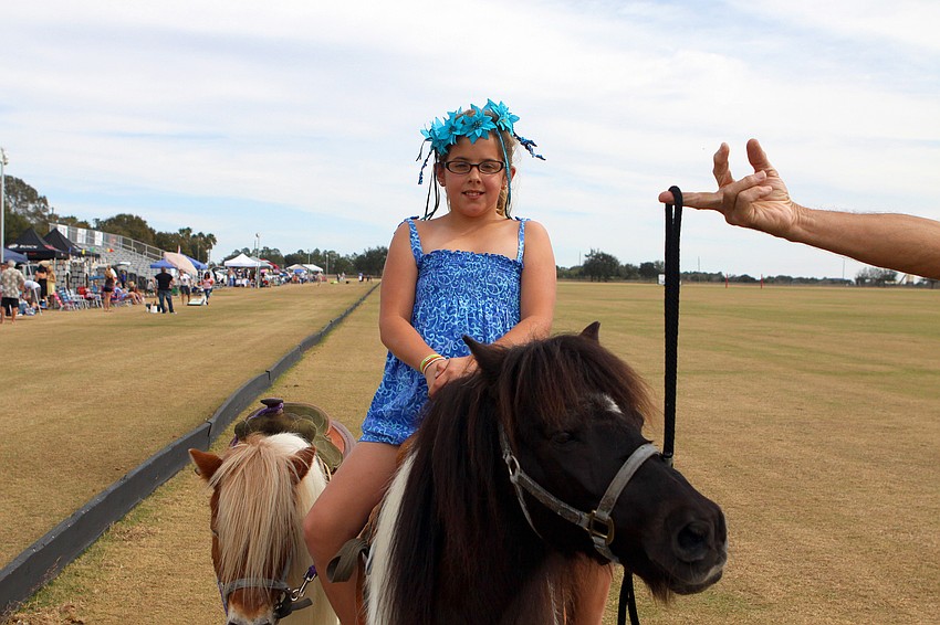 Carley Rodgers, 9, had fun riding around on the ponies, Sunday, Jan. 22, at the Sarasota Polo Club.