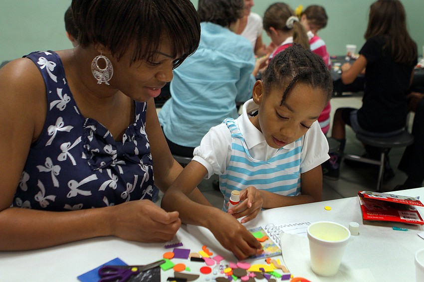 Angela and Shanear Shuler, 7 1/2, make a book about a talking birthday cake.