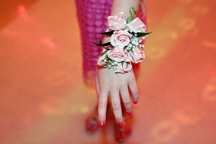 Lauren Garner, 8, shows off her corsage.