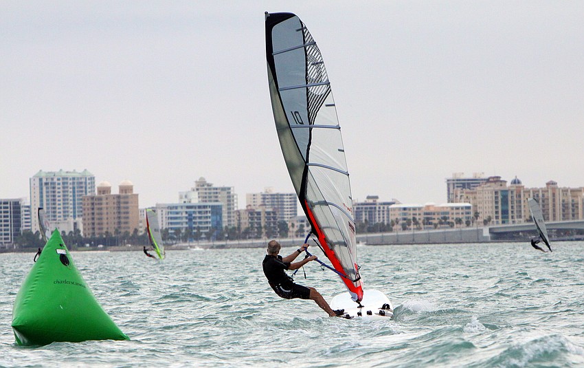 Don Wagner makes his way around the green buoy and continues on racing, Sunday, Feb. 26.