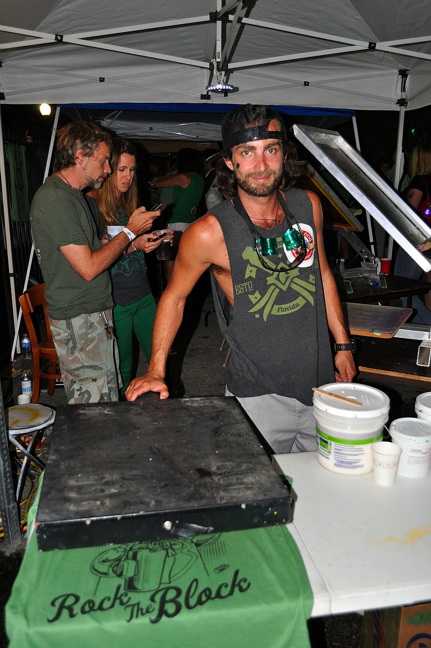Joe Lombardi from Clothesline Boutique made screen-printed t-shirts at Shamrock's 4th Annual St. Patrick's Day Block Party.