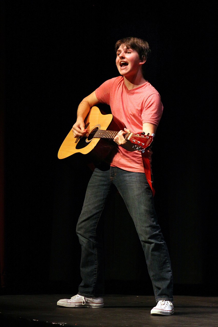 Danny Perrone, 17, sings and strums â€œThree Is A Magic Numberâ€, Friday, March 30.
