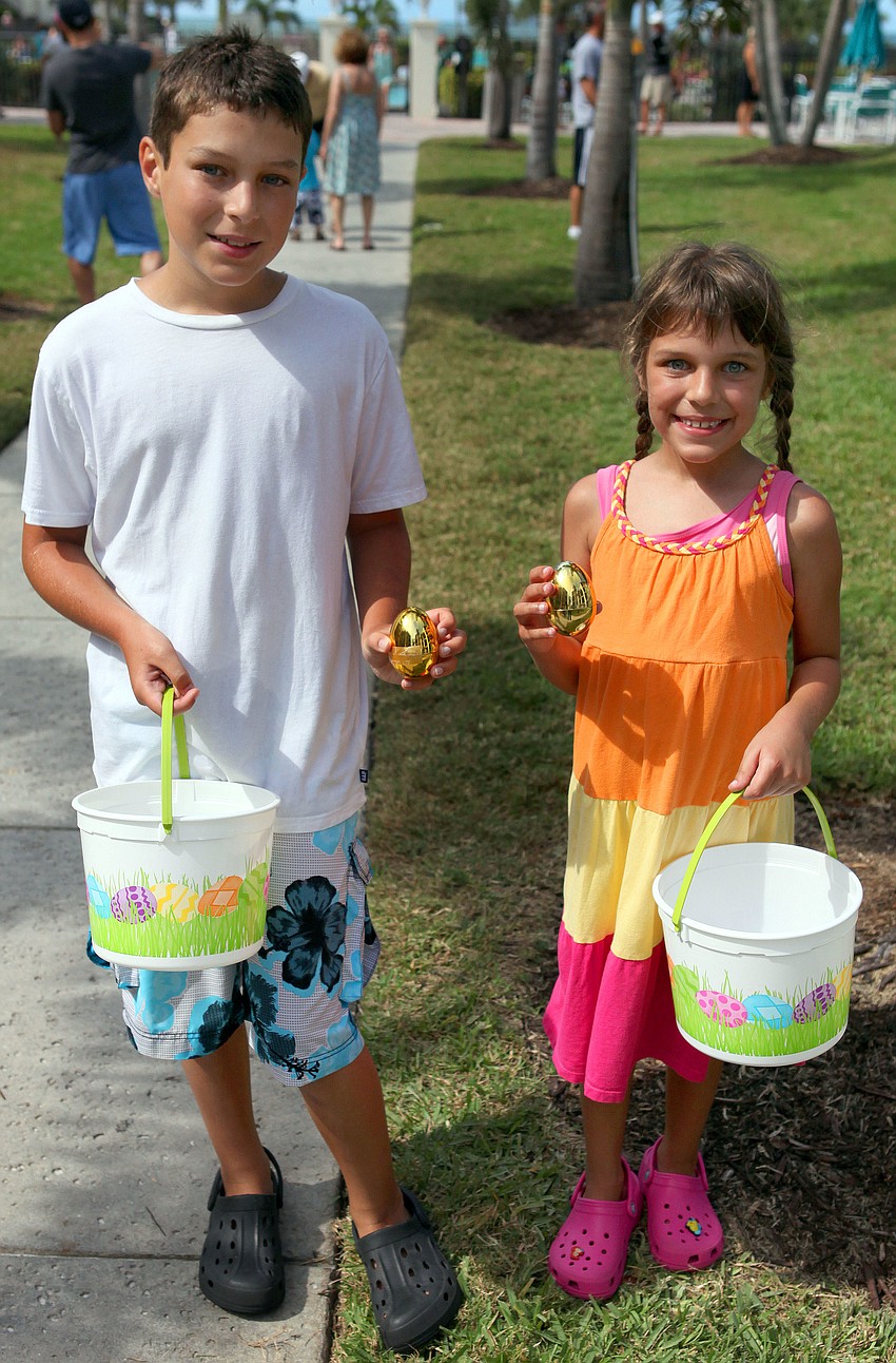 Jaydon Sonnenberg, 10, and Larissa Sonnenberg, 8, both found golden eggs during the egg hunt, Thursday, April 5, at Siesta Dunes.