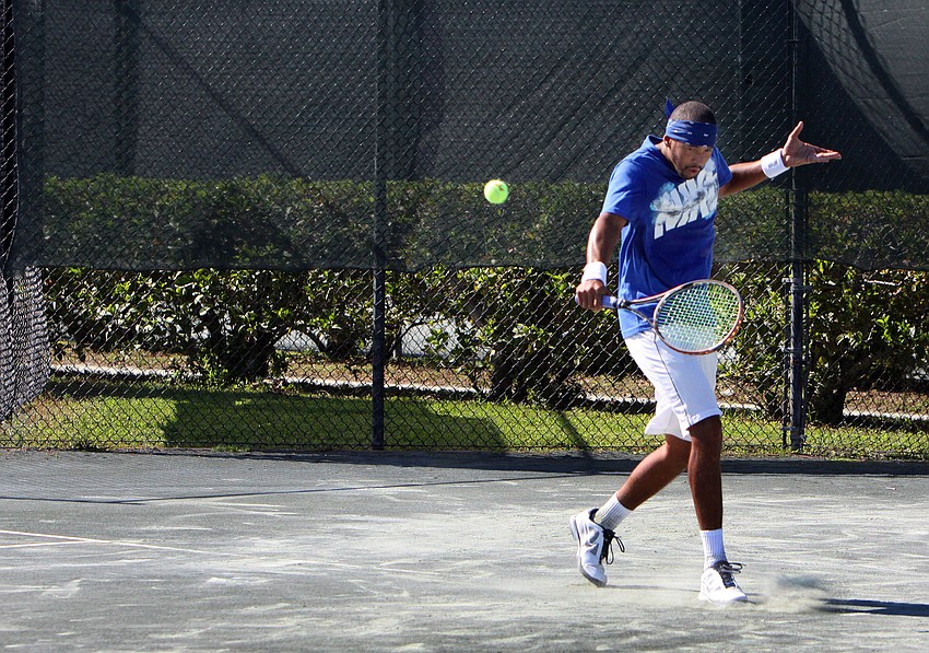 EJ Sanford hits an impressive one-handed backhand.