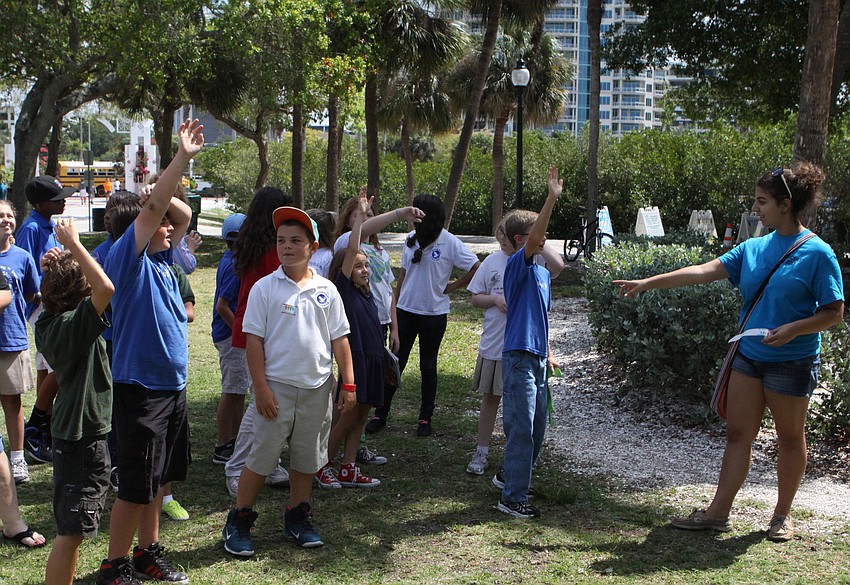 Amanda Russo, 17, led a group from Phillippi Shores Elementary around the Embracing Our Differences art exhibit, Friday, April 20.