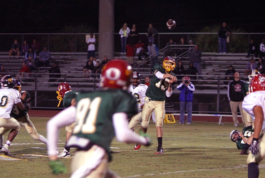 Rick Pecorelli, 81, prepares to catch the ball thrown by teammate Sean McAdams, 15.