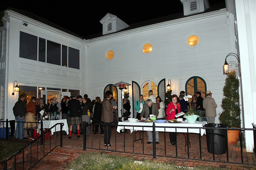 The crowd enjoyed drinks from The Shamrock and some finger food outside, Friday, Jan. 13 at the opening reception of S/ART/Q's Avant Garden at the Marie Selby Botanical Gardens.