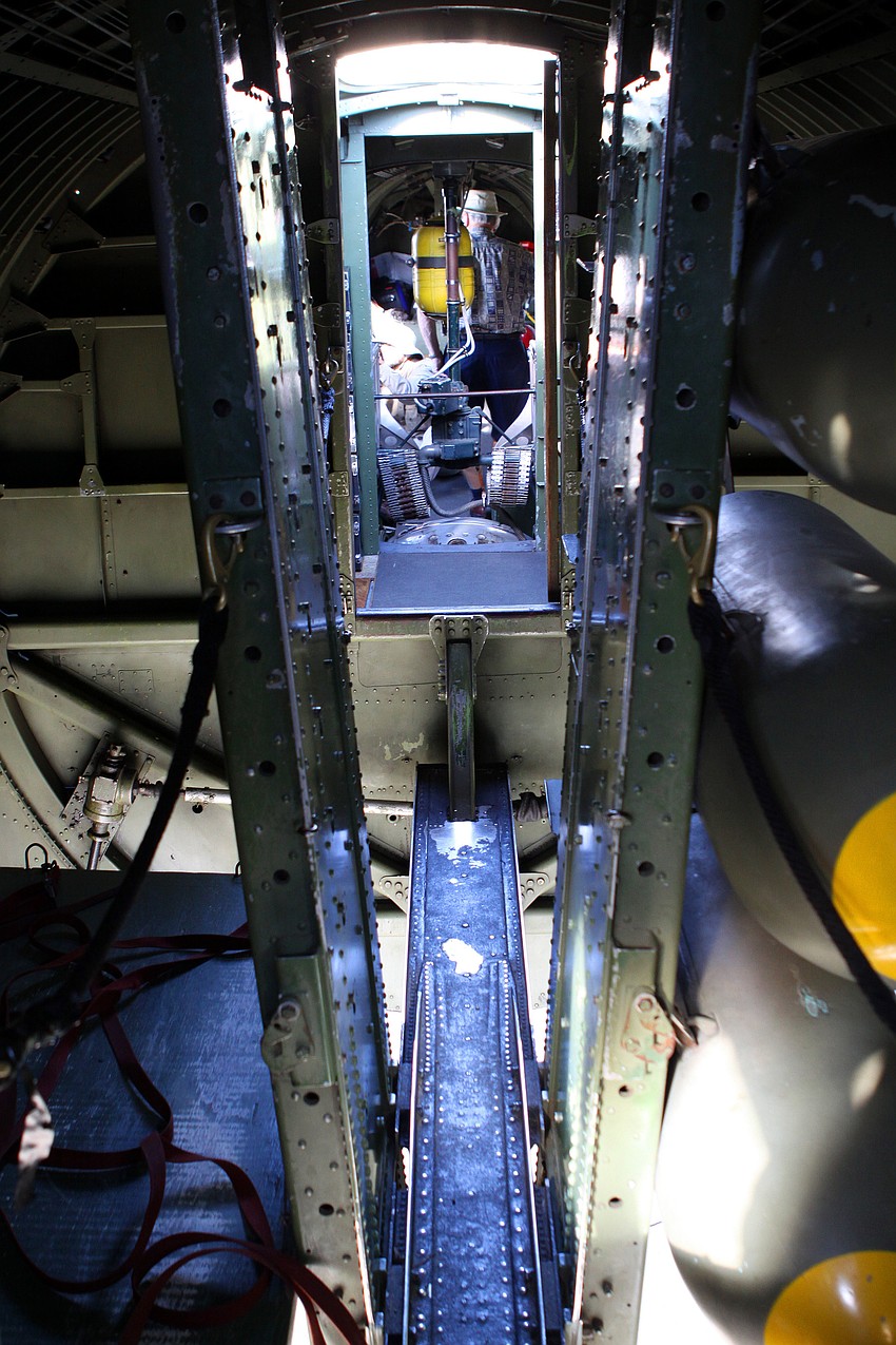 A view of the walkway from the cockpit to the back inside the 