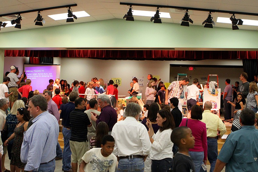 Students and parents walk around to see different exhibits in the cafeteria, Thursday, Feb. 16, during Science Night at Southside Elementary.