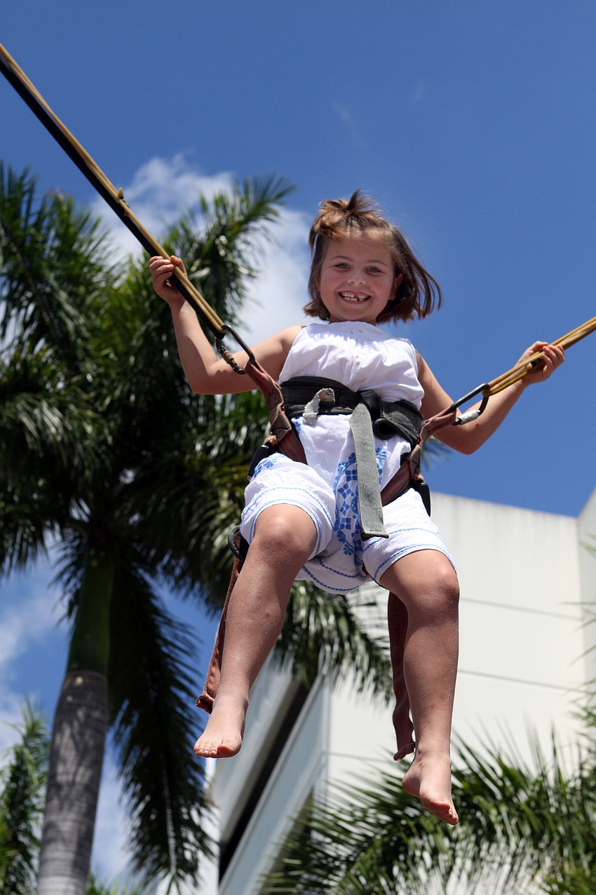 Olivia McClintock, 7, had fun jumping high into the air, Sunday, March 25.