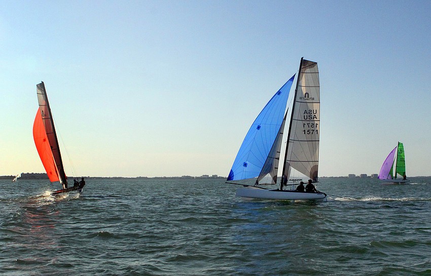 Members of the Sarasota Multihull team practice out in the Bay, Monday, Jan. 30.