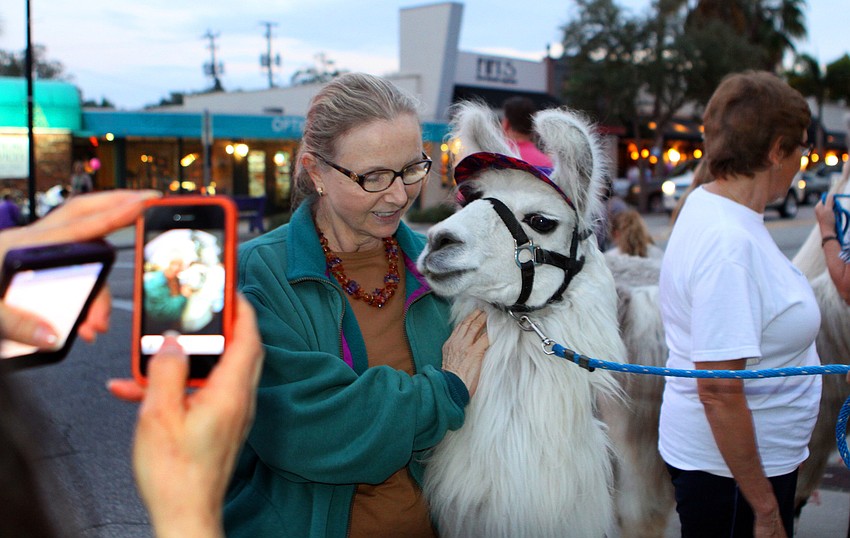 Alexandra Jupin gets her photo taken with Paintball Pete.