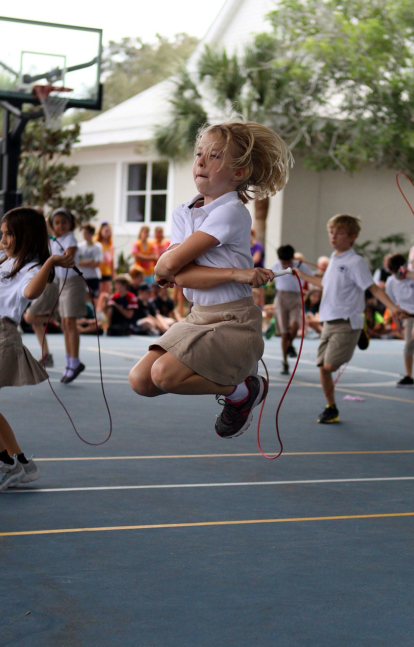 Ansley White get some air and shows off some fancy jump roping skills during the Jump Rope for Heart event on Friday.