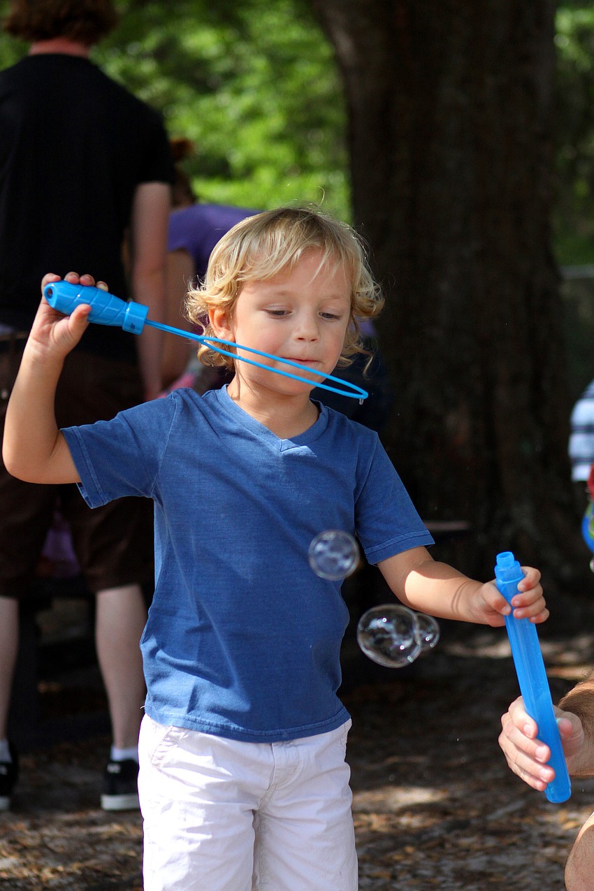 JJ Weatherbie, 3 Â½, has fun blowing bubbles.