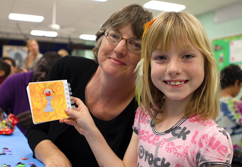 Jean Louise and Willow Schwartz, 8, made a book about their family.