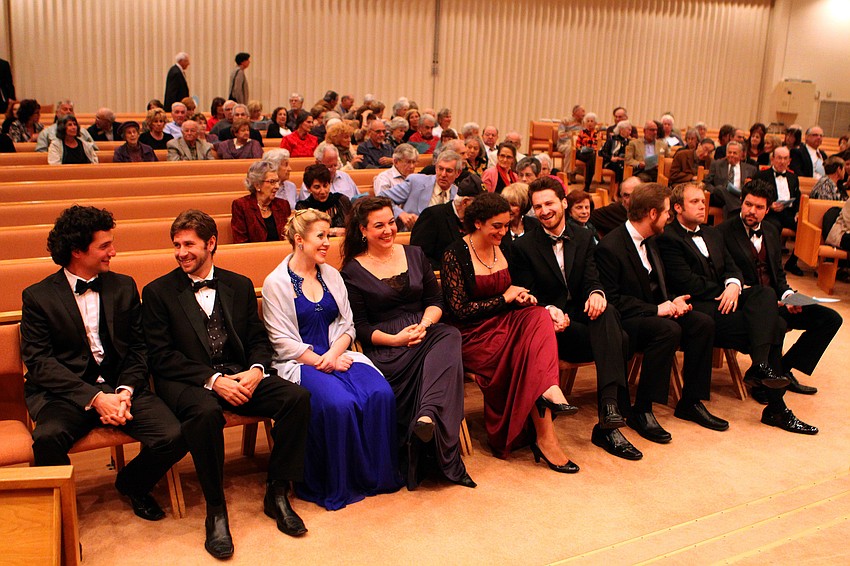Members of Sarasota Opera's 2012 Studio Artists Program chat among one another before performing, Tuesday, Feb. 21, at Temple Beth Israel.