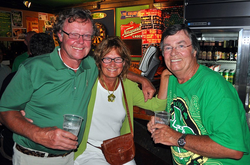 Mike and Diane Schmidt with Mickey O'Hurney have fun inside the Shamrock Pub, Saturday, March 17.
