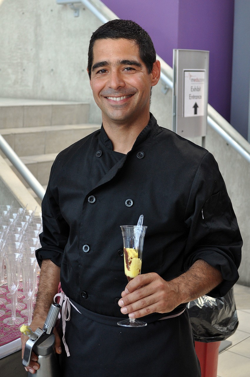 Leo Rojas of Porcelana shows off the chocolate truffle and passion fruit foam dessert