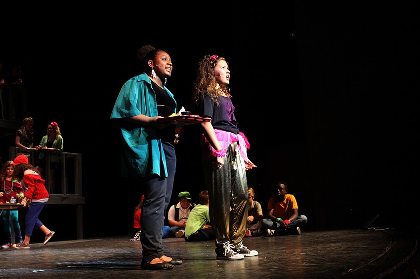 Mabel Washington, played by Nahryanna Young, 8th grade, and Carmen Diaz, played by Pamela Kurpiewski, 7th grade, talk about being famous during lunch.