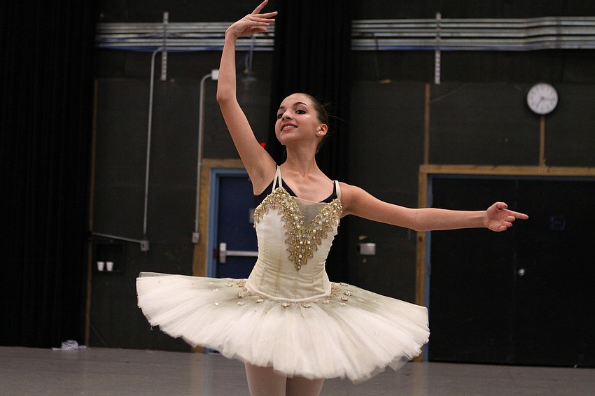 Athena Kavis, 13, runs through her dance during a dress rehearsal.