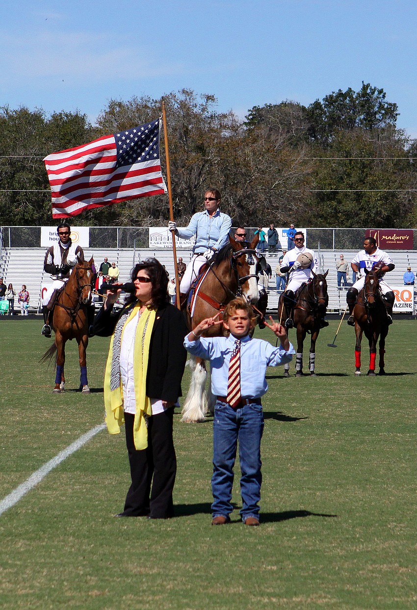 Nancy Apatow sang the National Anthem while Levi Waxler, 11, signed the lyrics, Sunday, Feb. 12.