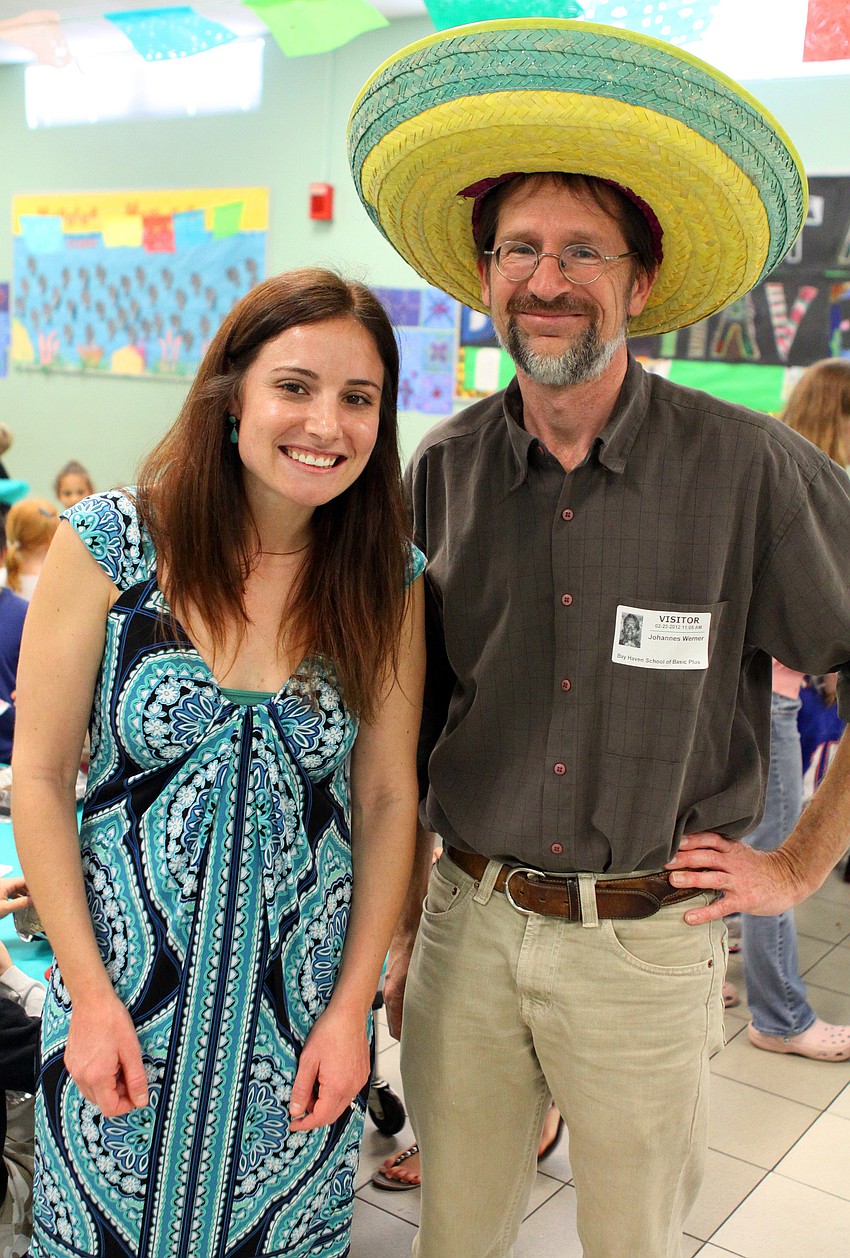 Jaime Vieira, Spanish teacher, with Johannes Werner, one of the many Spanish-speaking parent volunteers who helped out, Thursday, Feb. 23, at El Restaurante Bay Haven.
