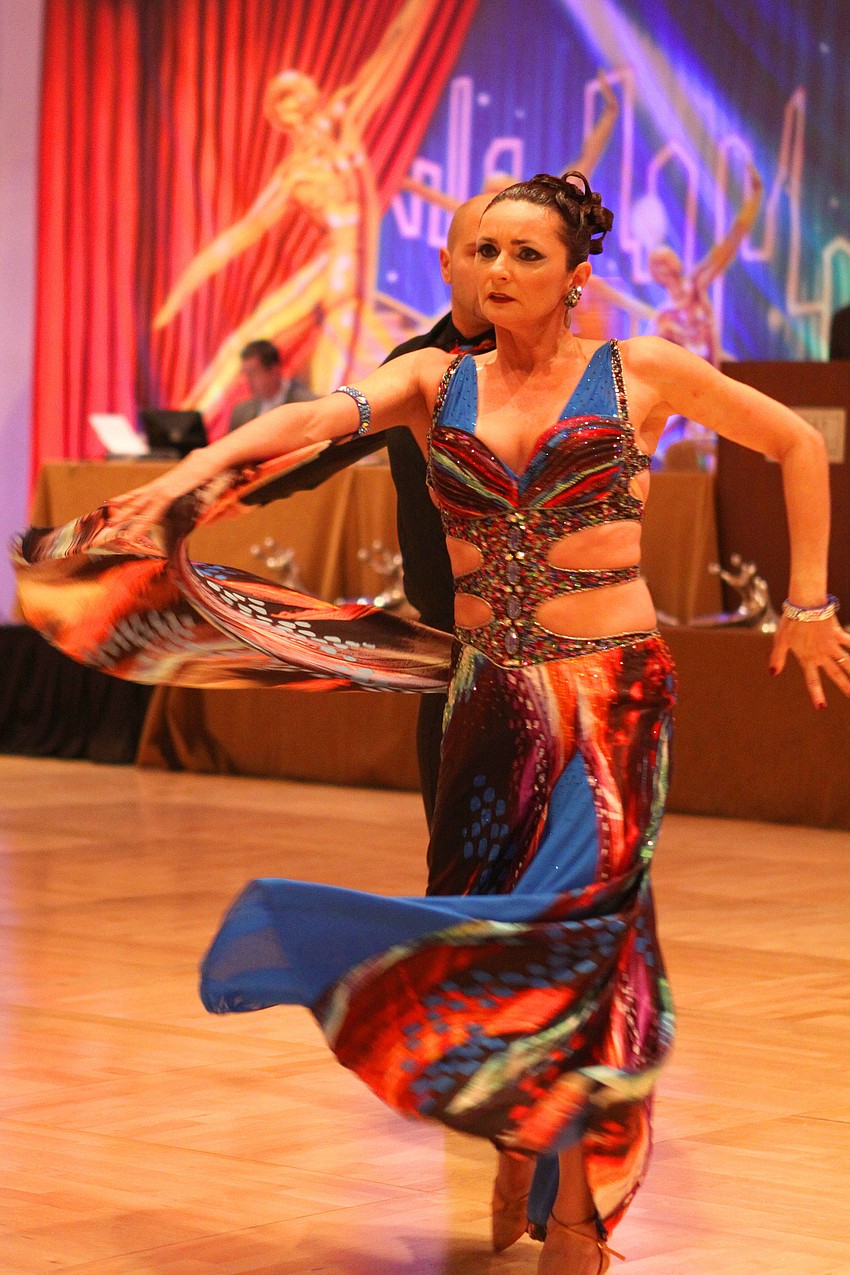 Aniko Toth's dress moves with her body while she danced with her partner, Spas Paskalev, Sunday, Jan. 15, during the Sarasota Challenge at the Hyatt Regency.