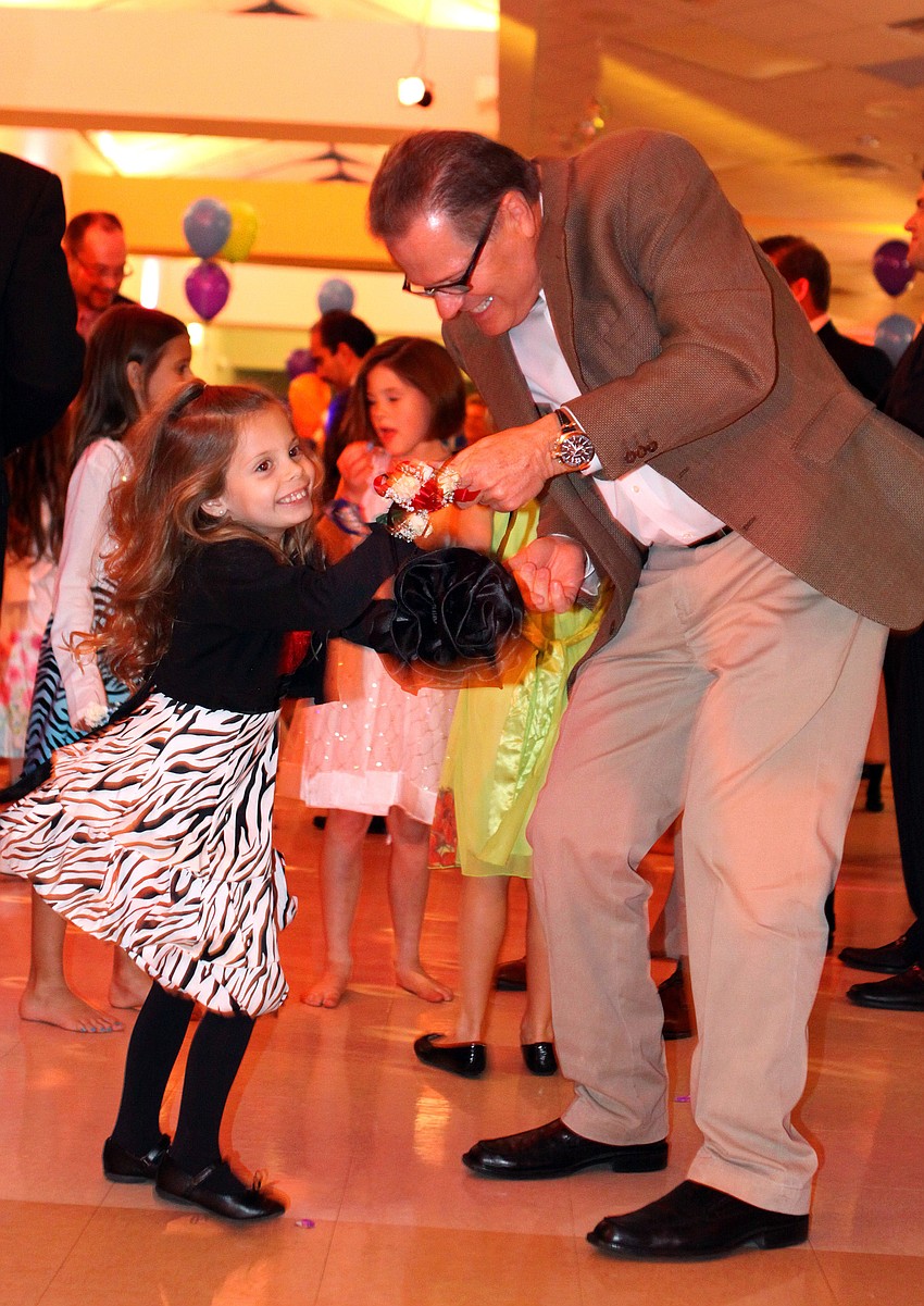 Alexa, 6, and Mike Rouen boogie down.