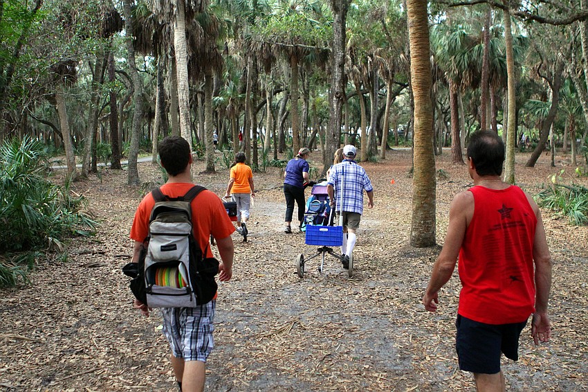 A team walks from one tee to the next, Saturday, Feb. 4, at the 16th annual Ice Bowl Disc Golf Tournament.