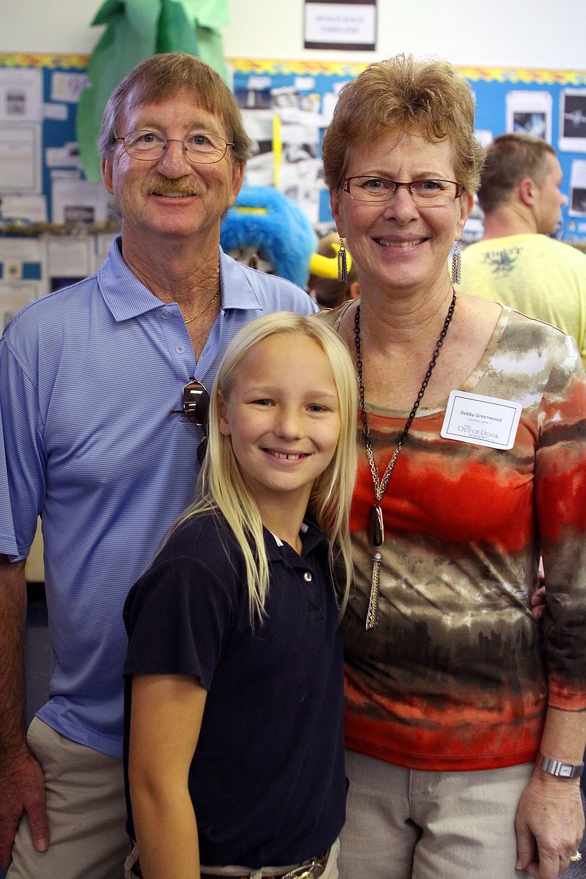 Caroline Lafoe, 5th grade, poses with her grandparents, Glenn and Debby Greenwood