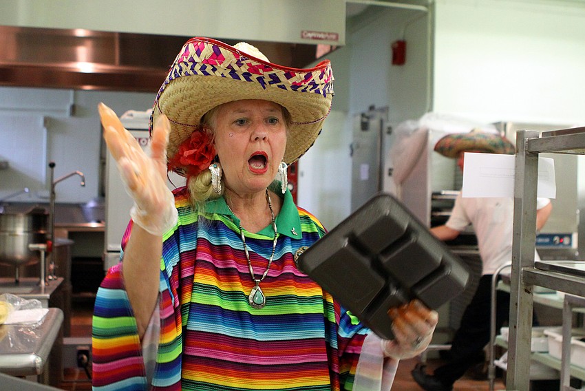 Terry Zangara had fun with the kids as they ordered their food in Spanish, Thursday, Feb. 23, at Bay Haven Elementary.