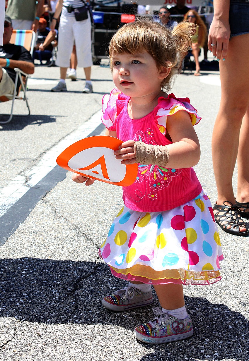 Mackenzie Poppa, 21 mos., has fun dancing to the band on the main stage, Sunday, March 25, at the 17th annual Giving Hunger the Blues festival.