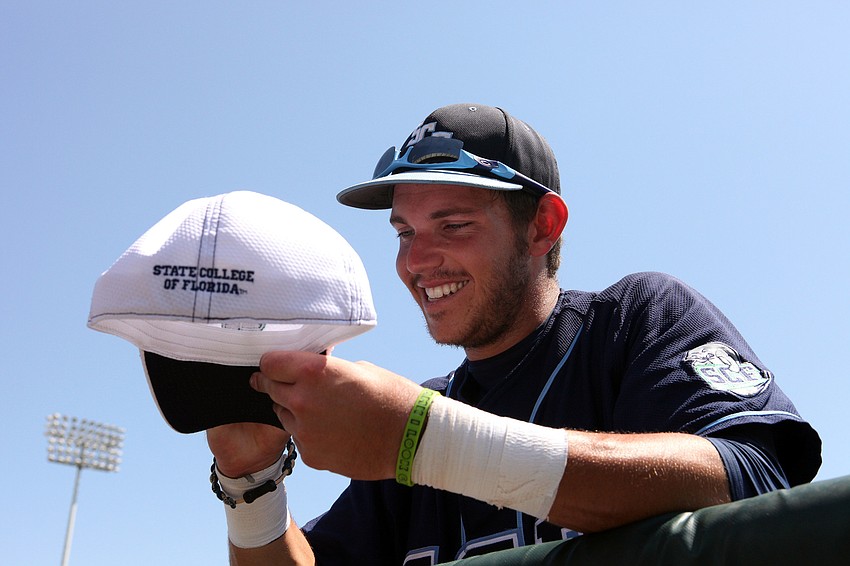 Connor Hale, 19, was asked to sign an SCF Manatee baseball cap following the game on Tuesday.