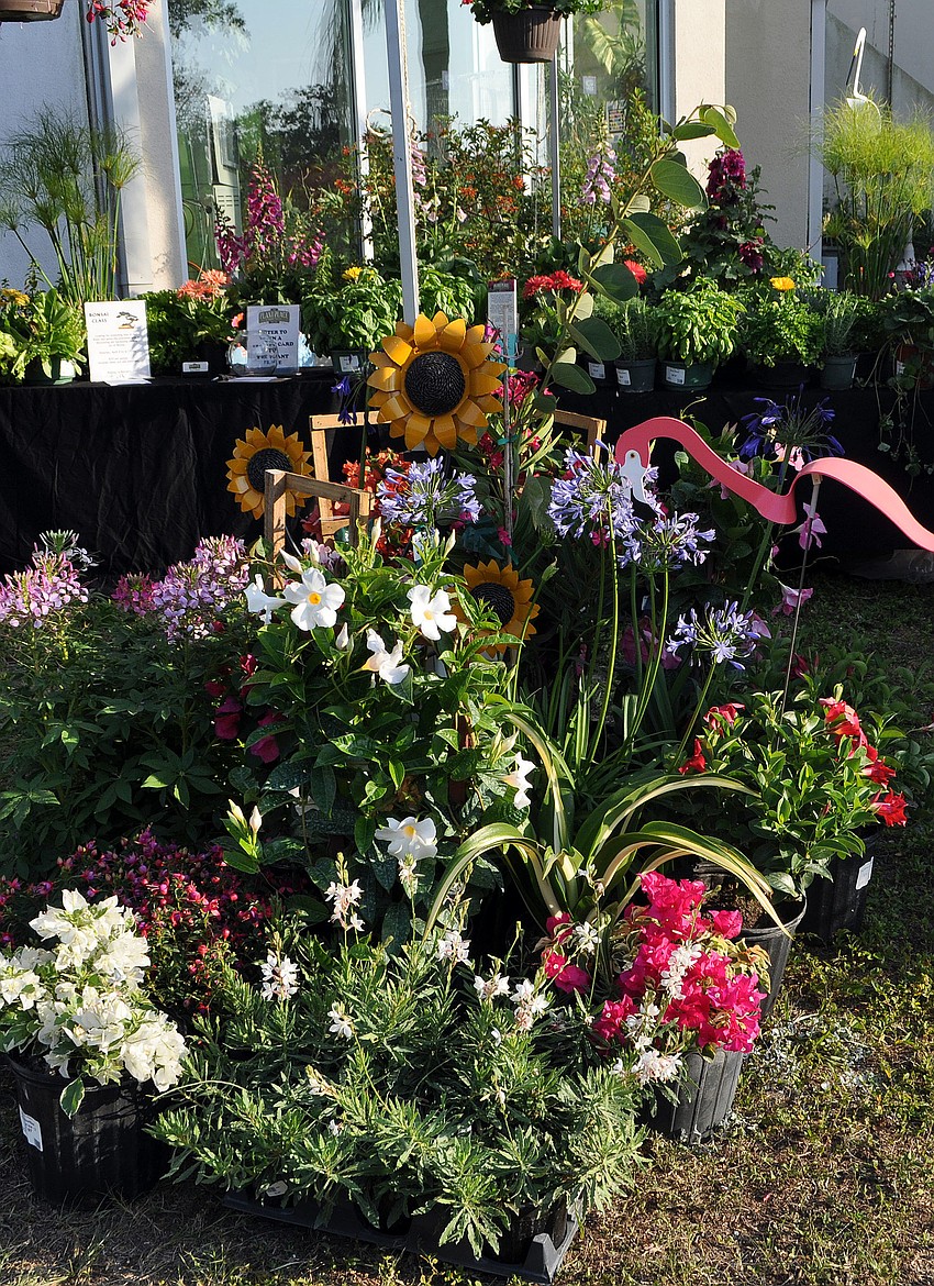 Beautiful flowers, arrangements and garden art from The Plant Place were on display outside of G.Wiz in the Marketplace at the Second Annual Simply Sarasota Kitchen and Garden Festival.