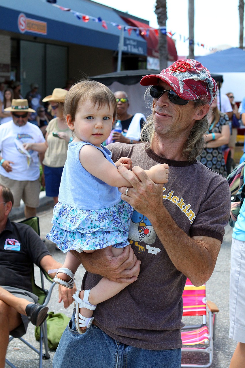 Eugene Roberts dances with his daughter, Emily, 15 mos.