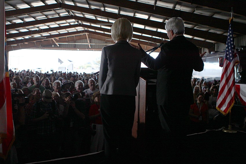 Callista and Newt Gingrich look out into the crowd of 4,700 people who came out Tuesday, Jan. 24, to Dolphin Aviation to hear the Presidential contender speak.