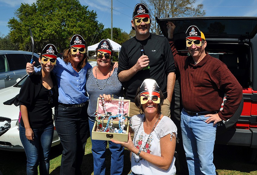 Jocelyn Vines, Michelle Pilkington, Vanessa Stull, Anne Barrow, Randy Stull and Jack Pilkington wore pirate masks and had their very own treasure chest, Sunday, March 4, at the Sarasota Polo Grounds.