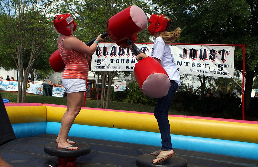 Lauren Schminky and Ivy Prost battle one another at the Gladiator Joust.
