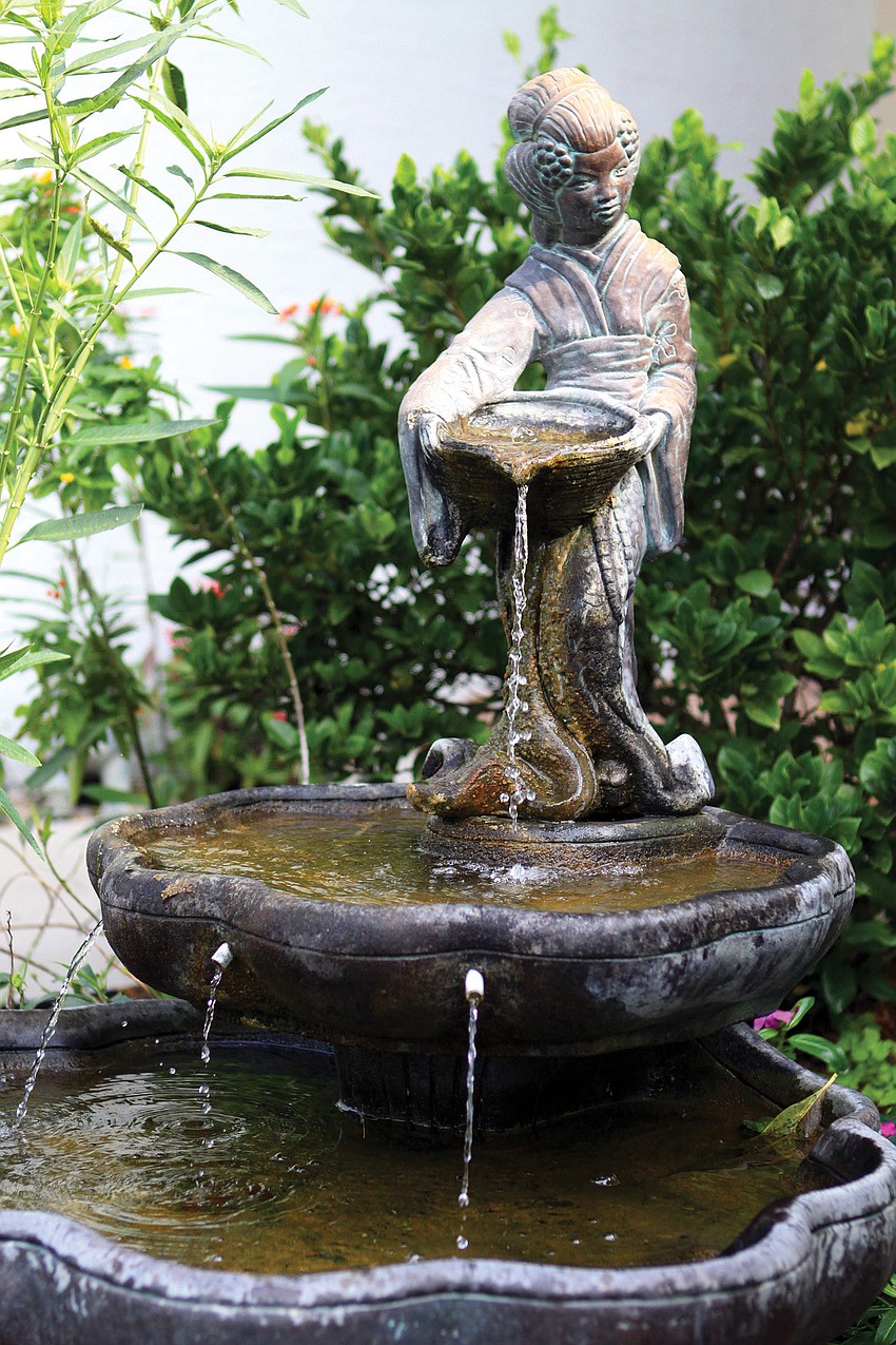 Olivia Haynes loves Asian art and bought this fountain to go in the front yard of her home.