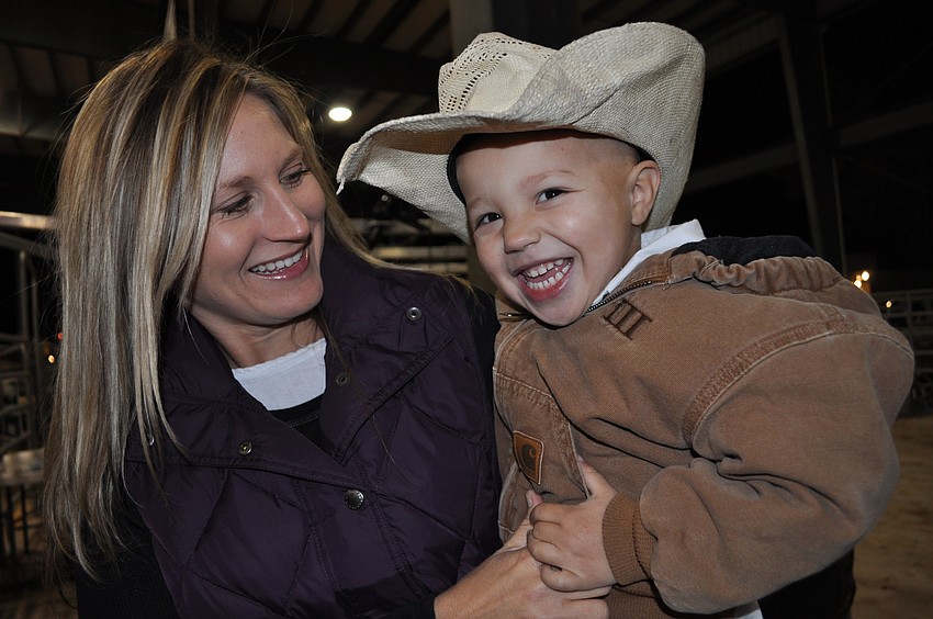 Trace Drake, 3, pictured with his mom, Erin, loved being around the cows.