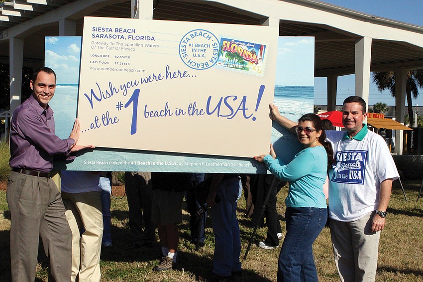 Kevin Cooper, of the Siesta Chamber, Lourdes Ramirez and Rob Lewis, of Sarasota County Government.