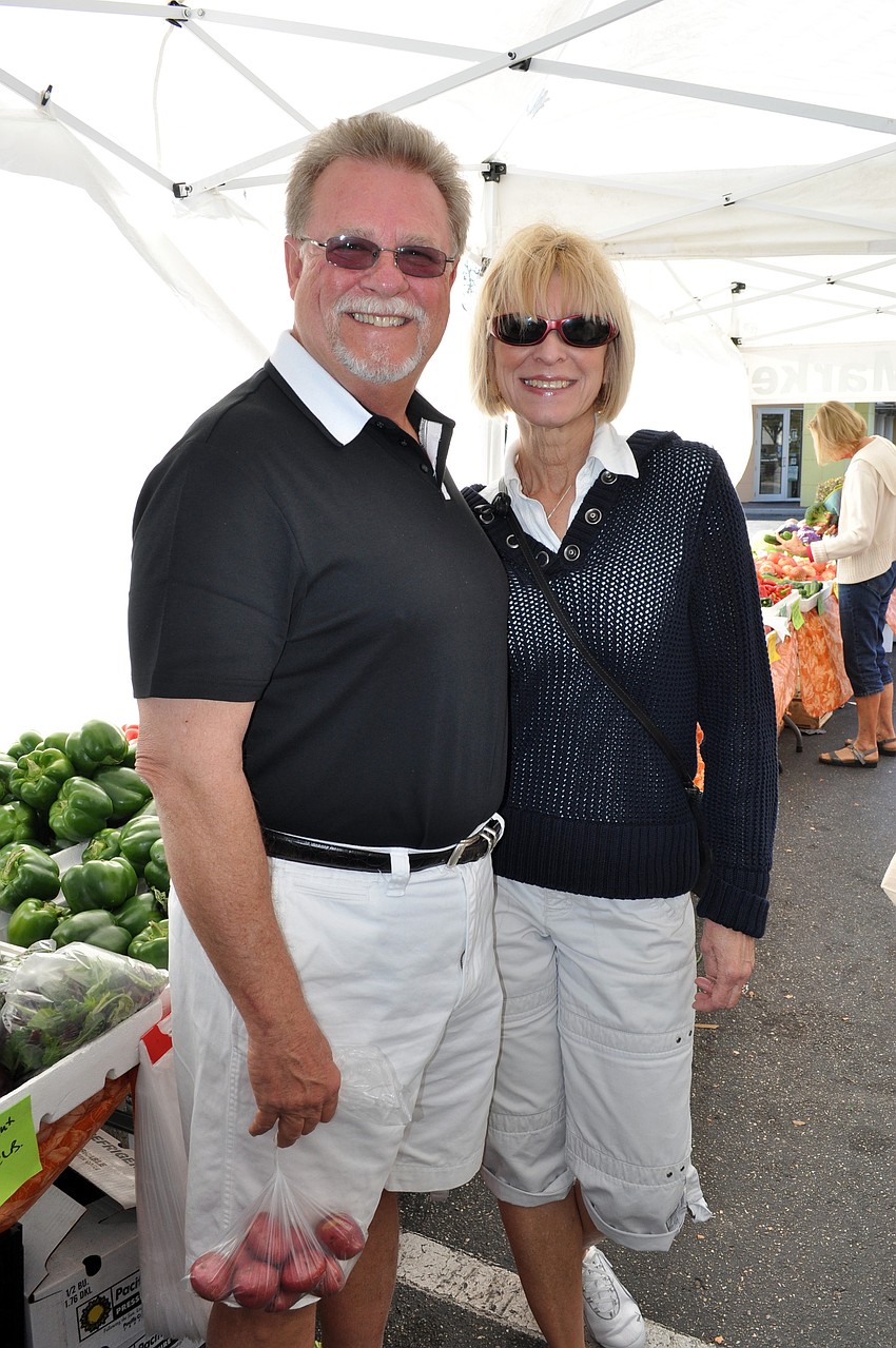 John and Judy Wick of St. Louis, Mo. made sure to pick up some produce during their first trip to the market.