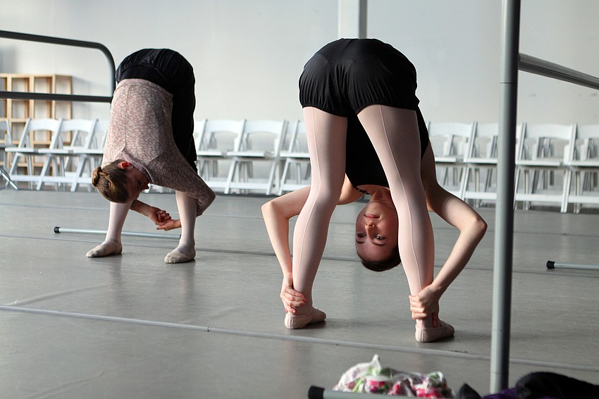 Allison Forsyth, 15, does some stretching during rehearsal, Friday, Jan. 6, at Studio 20.