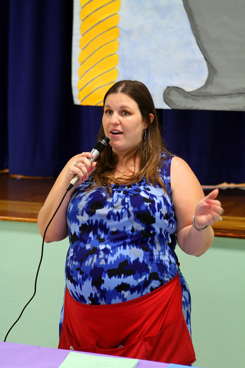 Michala Chipurnoi, third grade teacher, talks to the students and their parents about the 5th annual Build a Book night at Bay Haven Elementary.