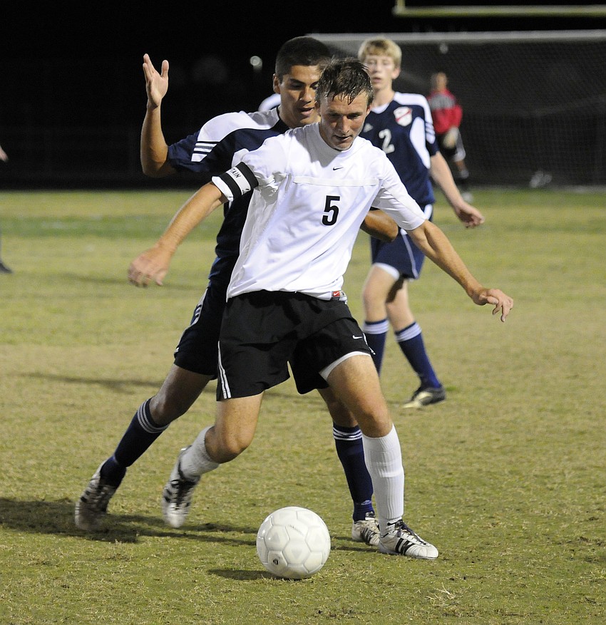 Braden River senior Matt McNab fights off a Manatee opponent during the Class 4A-District 11 championship Jan. 27.